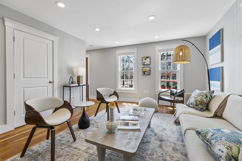 591 Somerville Avenue, Unit 7 Somerville, MA 02143 - Photo 6 of 20 a living room with furniture and wooden floor