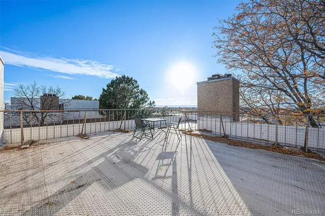 a balcony with wooden floor