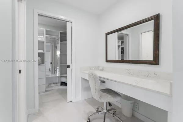 a utility room with cabinets washer and dryer