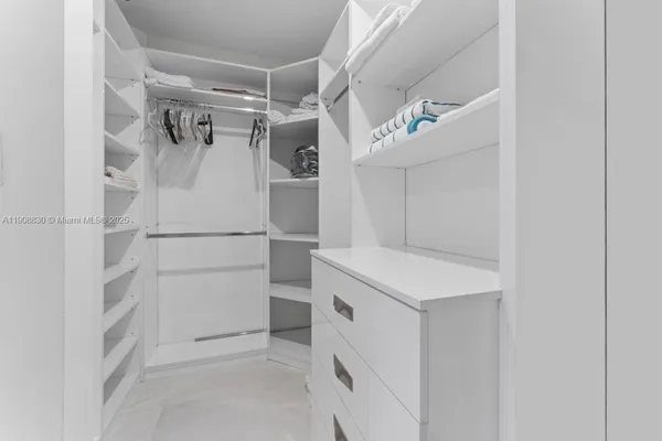 a bathroom with a granite countertop sink a toilet a mirror and shower