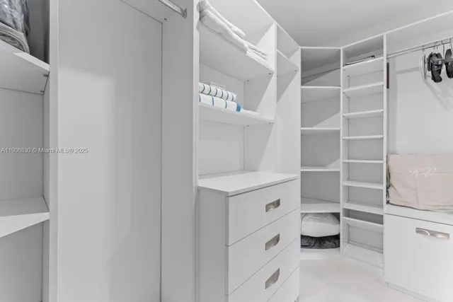 a bathroom with a tub shower and a sink