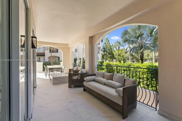 a view of a patio with table and chairs and potted plants