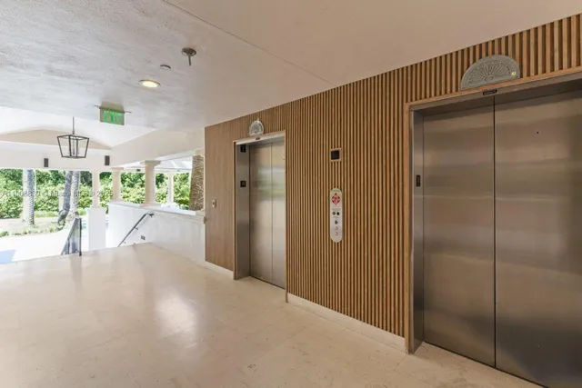 a front view of multiple houses with yard