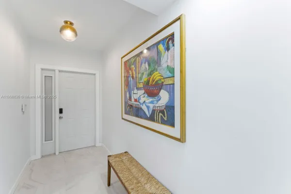 a workspace with a painting on the wall