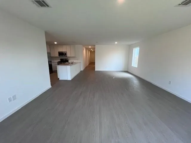 a view of a kitchen with a sink and a window