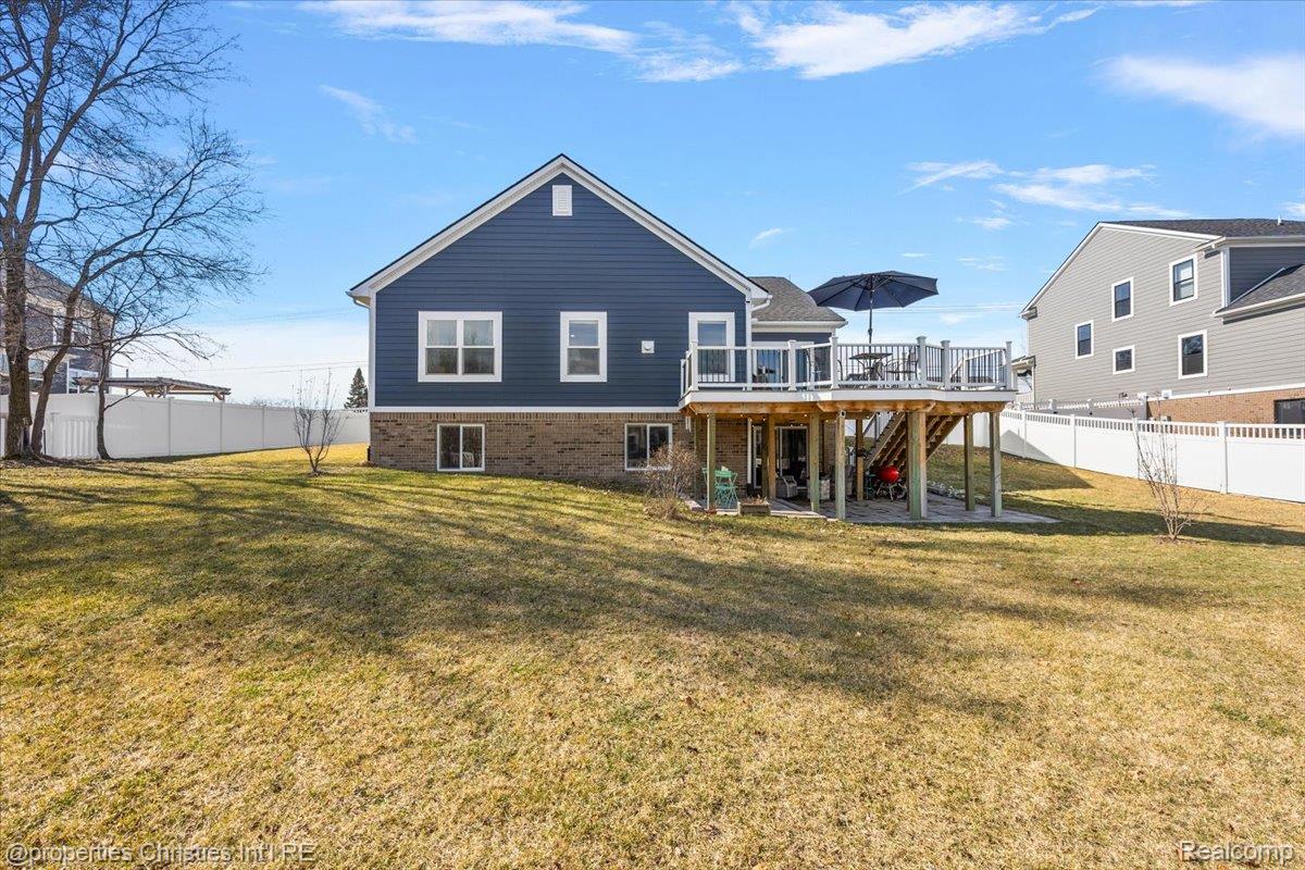 913 Ridge Road South Canton, MI 48188 - Photo 6 of 51 Back of property featuring a patio, a deck, and brick siding