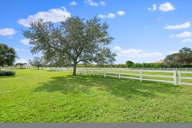 a view of a field with sitting area