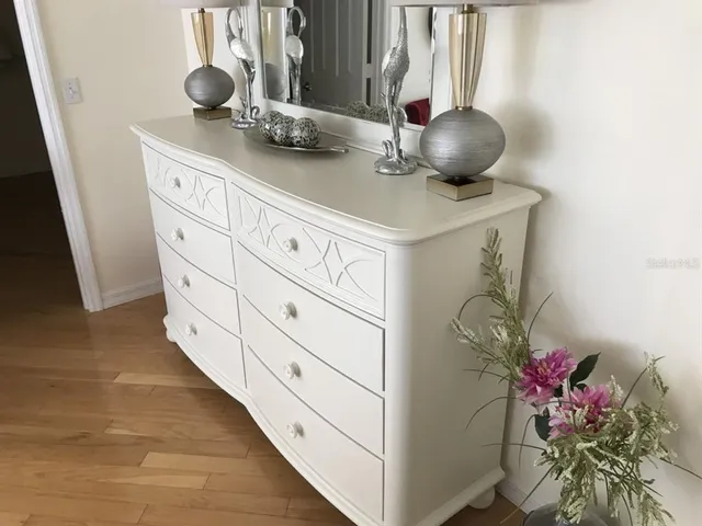 a kitchen with a sink a stove and cabinets