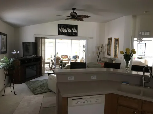 a kitchen with a sink appliances and a counter top space