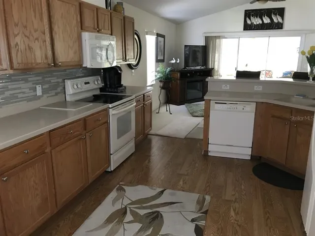 a kitchen with a sink cabinets and appliances
