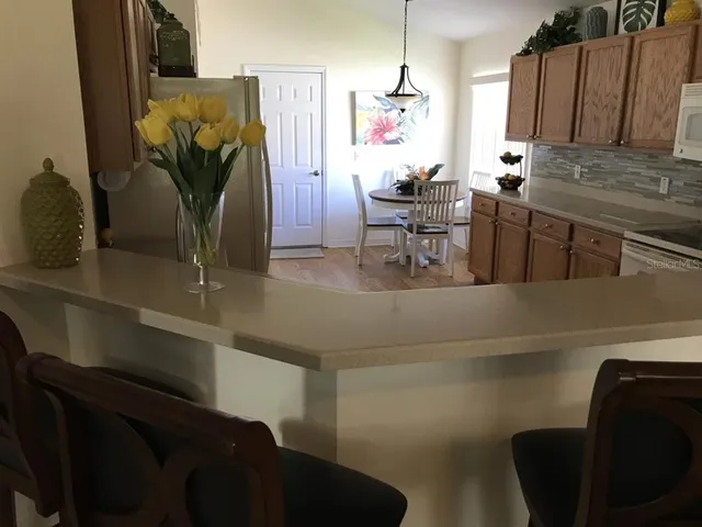 a living room with furniture and a mirror