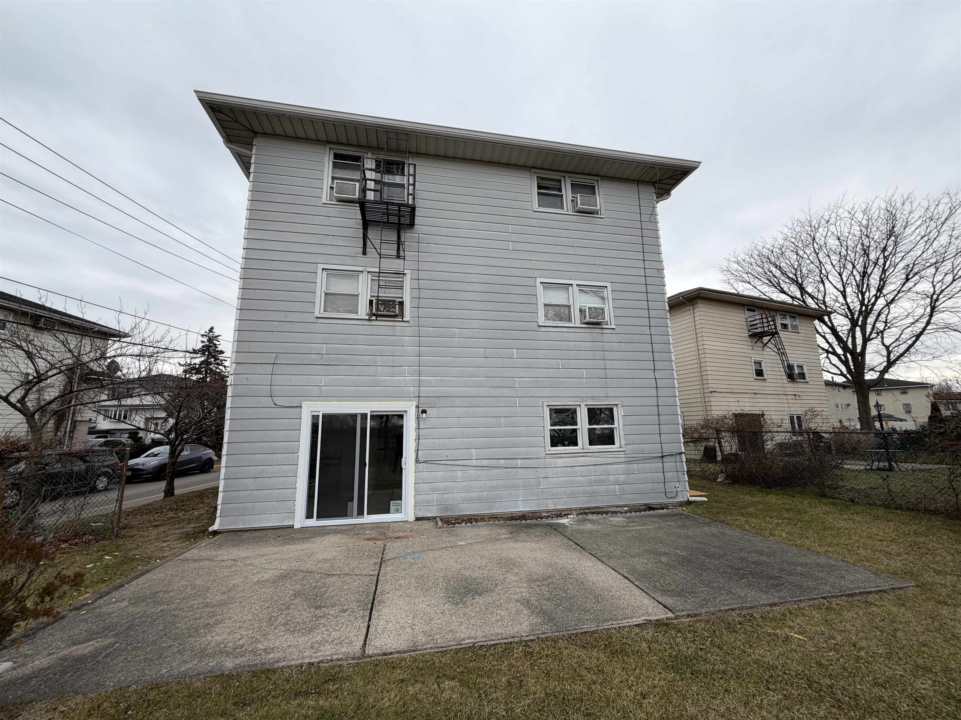 14 Acorn Road, Unit 1 Secaucus, NJ 07094 - Photo 13 of 14 a front view of a house with a yard and garage