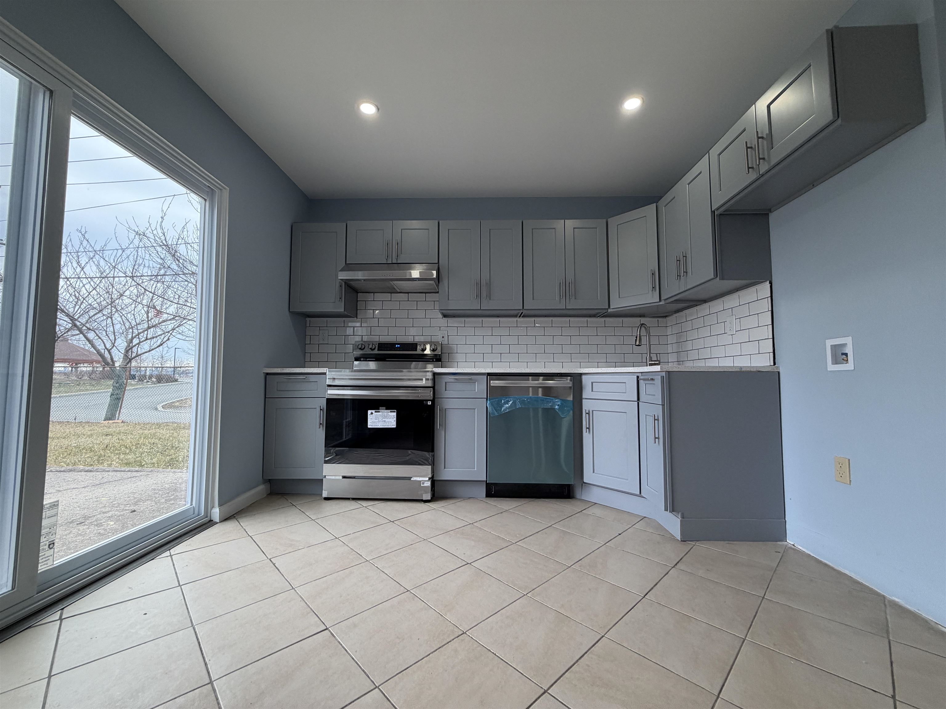 14 Acorn Road, Unit 1 Secaucus, NJ 07094 - Photo 3 of 14 a kitchen with stainless steel appliances granite countertop a refrigerator and a sink