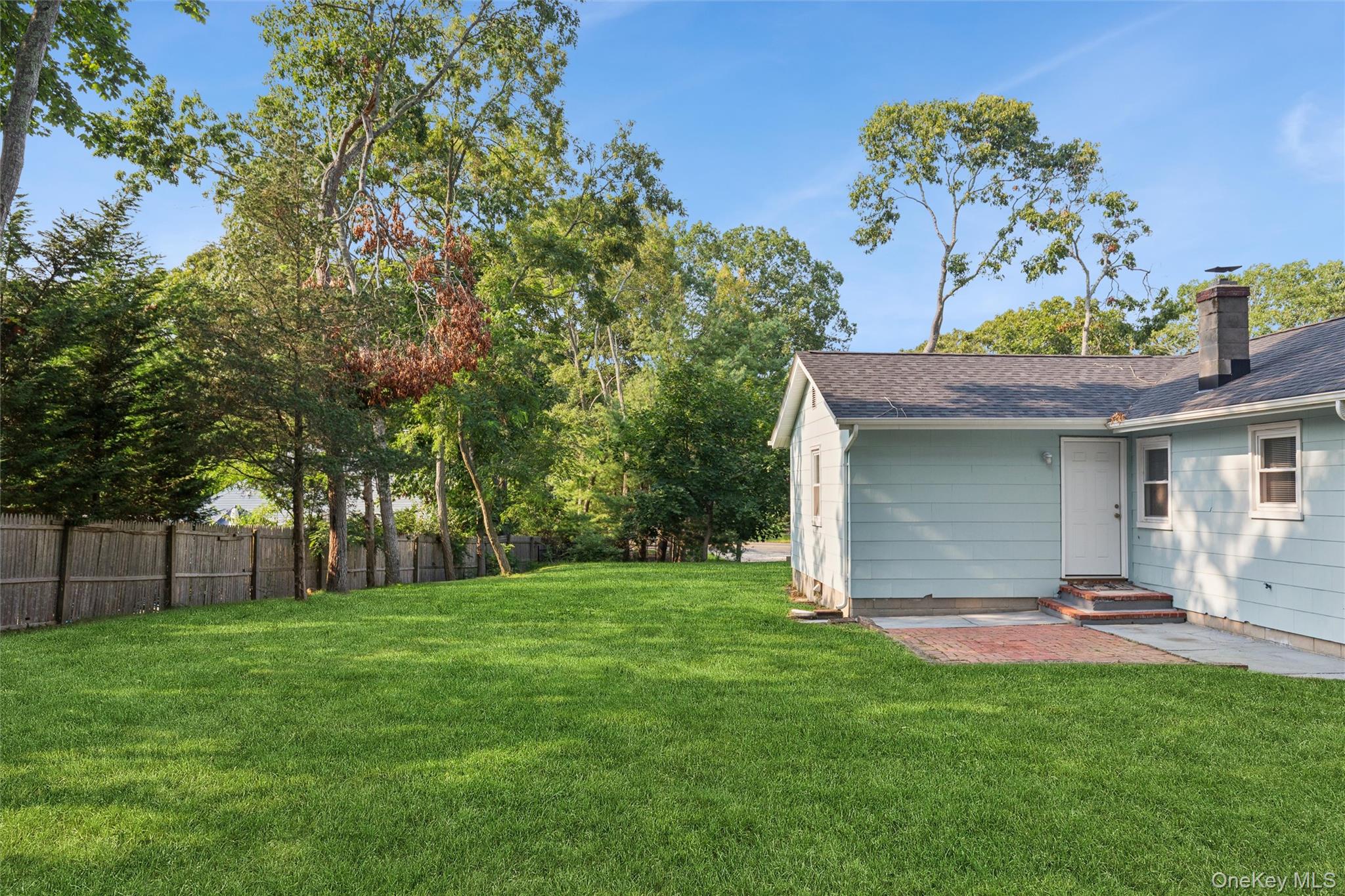171 Wakeman Road Hampton Bays, NY 11946 - Photo 15 of 18 Backyard with stone space