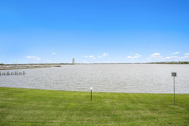 a view of a lake with a big yard
