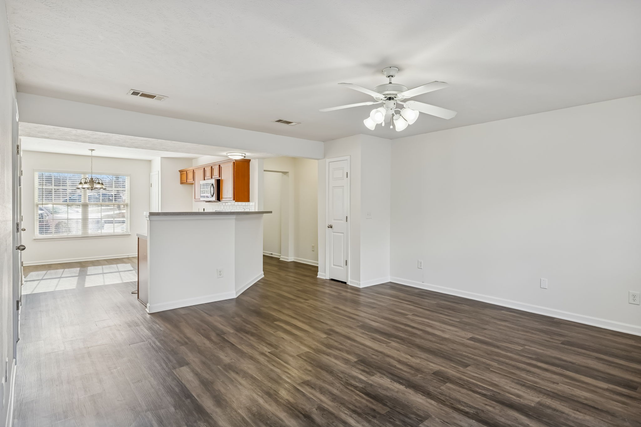 1791 Red Jacket Drive Antioch, TN 37013 - Photo 12 of 48 a view of an empty room with window and wooden floor