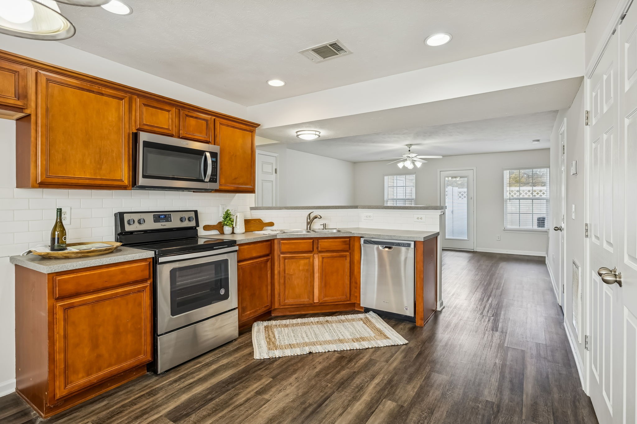 1791 Red Jacket Drive Antioch, TN 37013 - Photo 17 of 48 a kitchen with stainless steel appliances granite countertop a stove a sink and a microwave