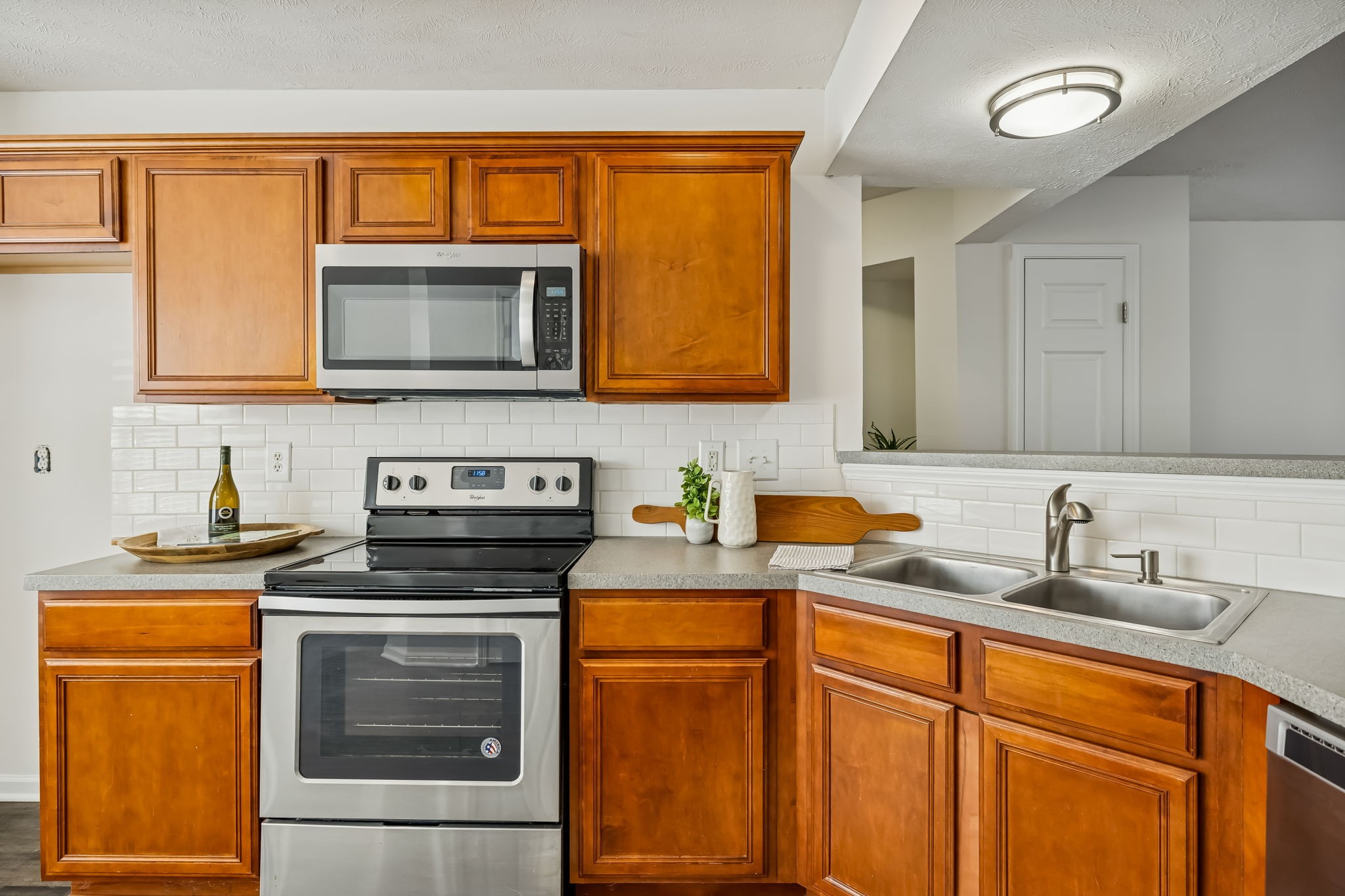 1791 Red Jacket Drive Antioch, TN 37013 - Photo 20 of 48 a kitchen with stainless steel appliances granite countertop a sink stove and microwave