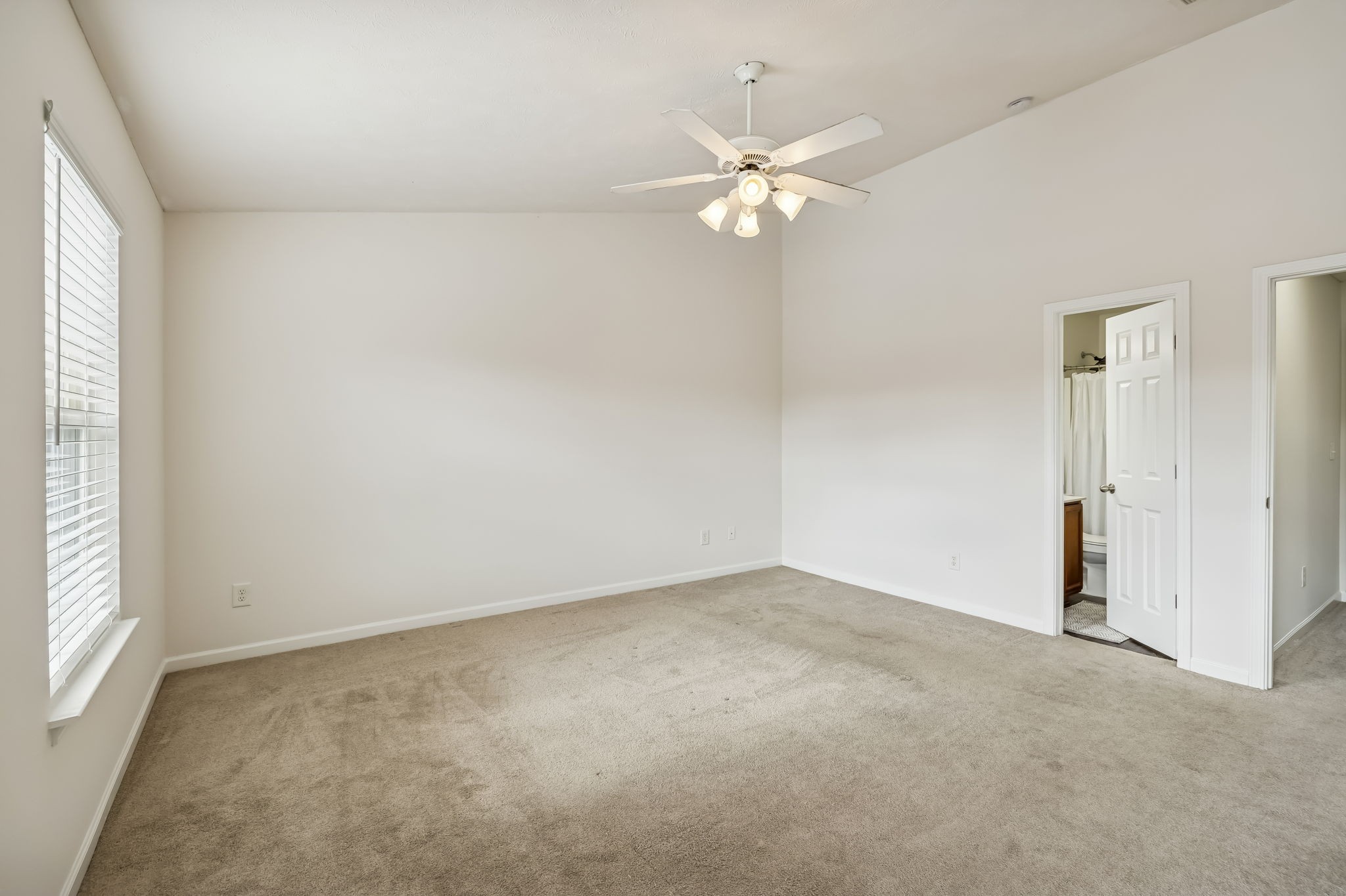 1791 Red Jacket Drive Antioch, TN 37013 - Photo 28 of 48 an empty room with a chandelier fan and windows