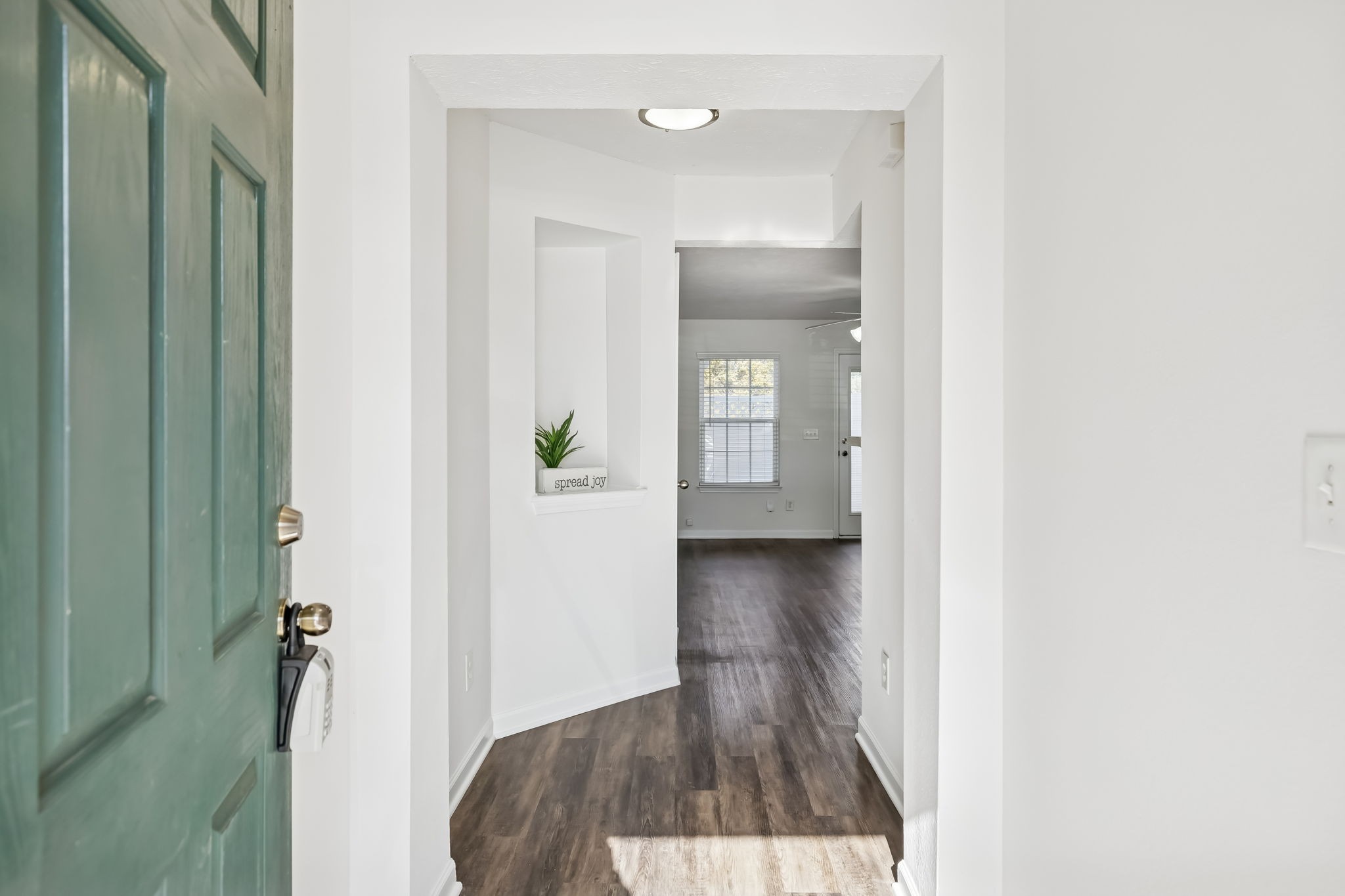 1791 Red Jacket Drive Antioch, TN 37013 - Photo 4 of 48 a view of a hallway with wooden floor and a living room
