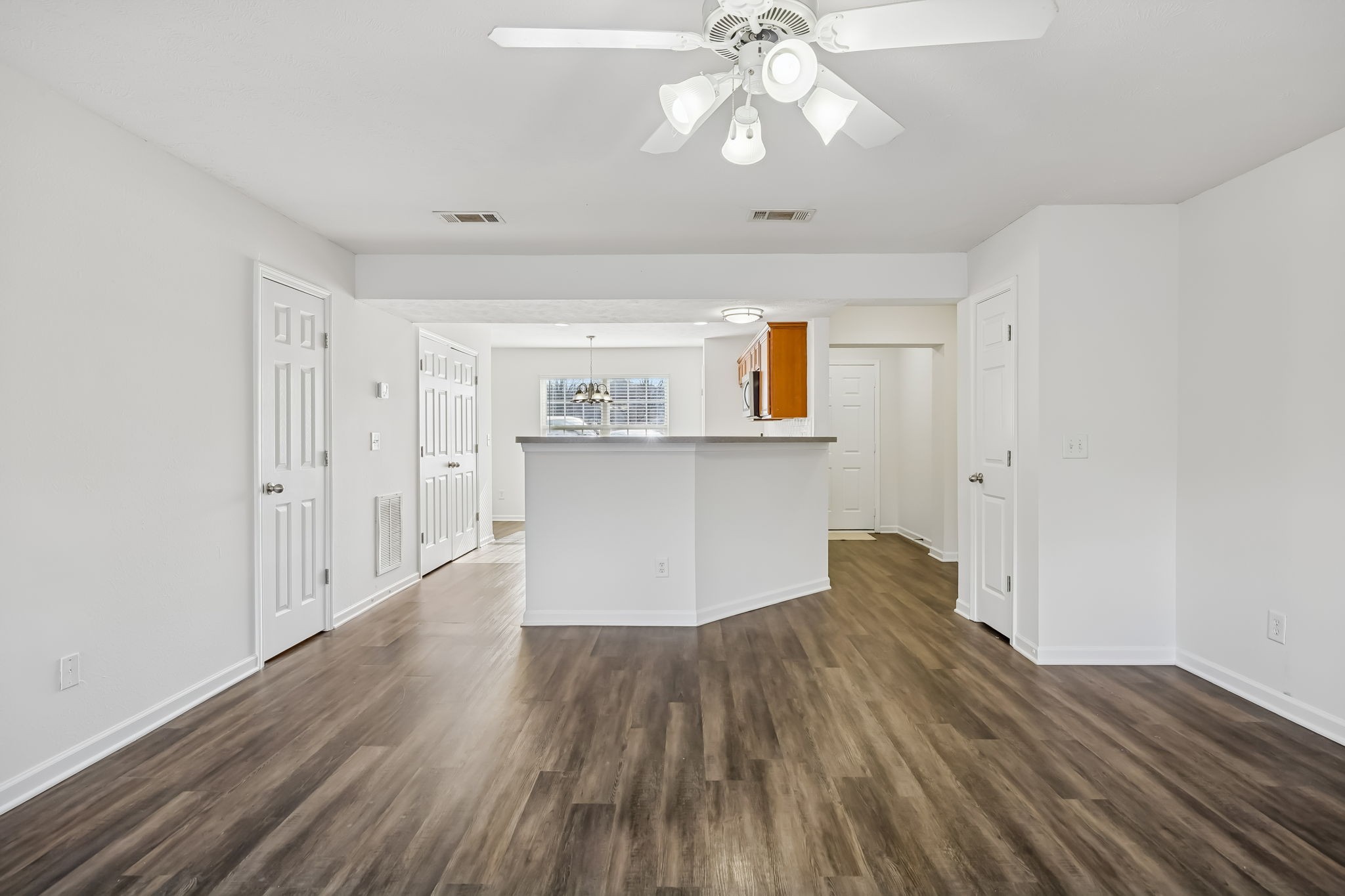 1791 Red Jacket Drive Antioch, TN 37013 - Photo 7 of 48 a view of a kitchen with wooden floor and a ceiling fan
