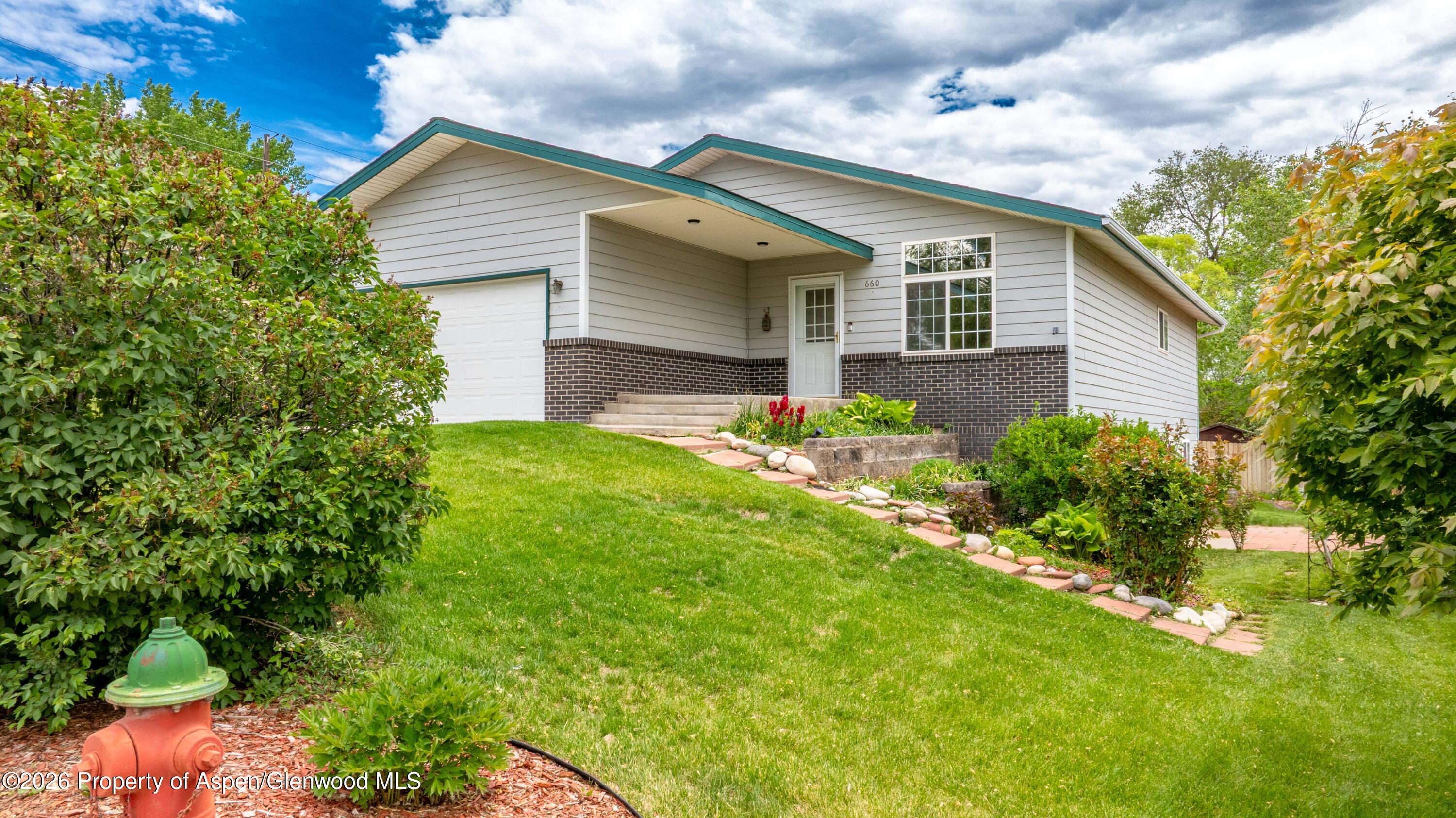 660 Aspen Avenue Rifle, CO 81650 - Photo 3 of 30 a view of a house with a yard