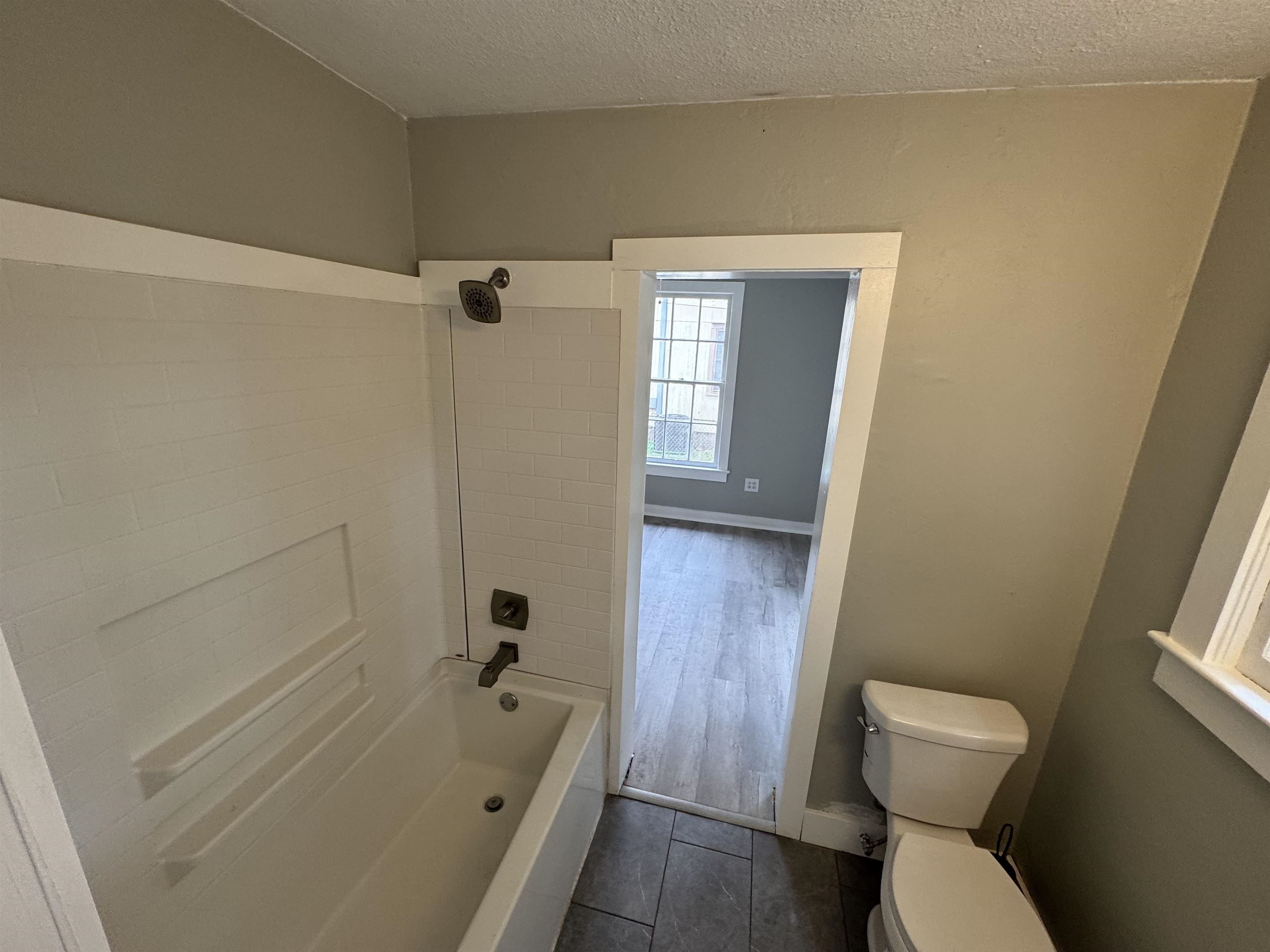 2909 Lane Street Palatka, FL 32177 - Photo 15 of 21 a bathroom with a sink a toilet and shower