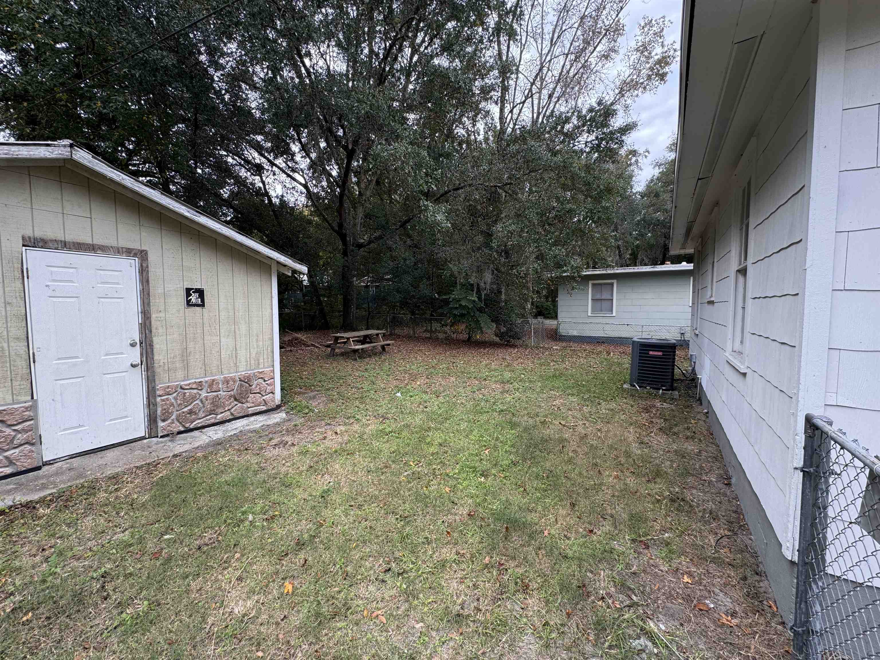 2909 Lane Street Palatka, FL 32177 - Photo 20 of 21 a backyard of a house with oven and garden