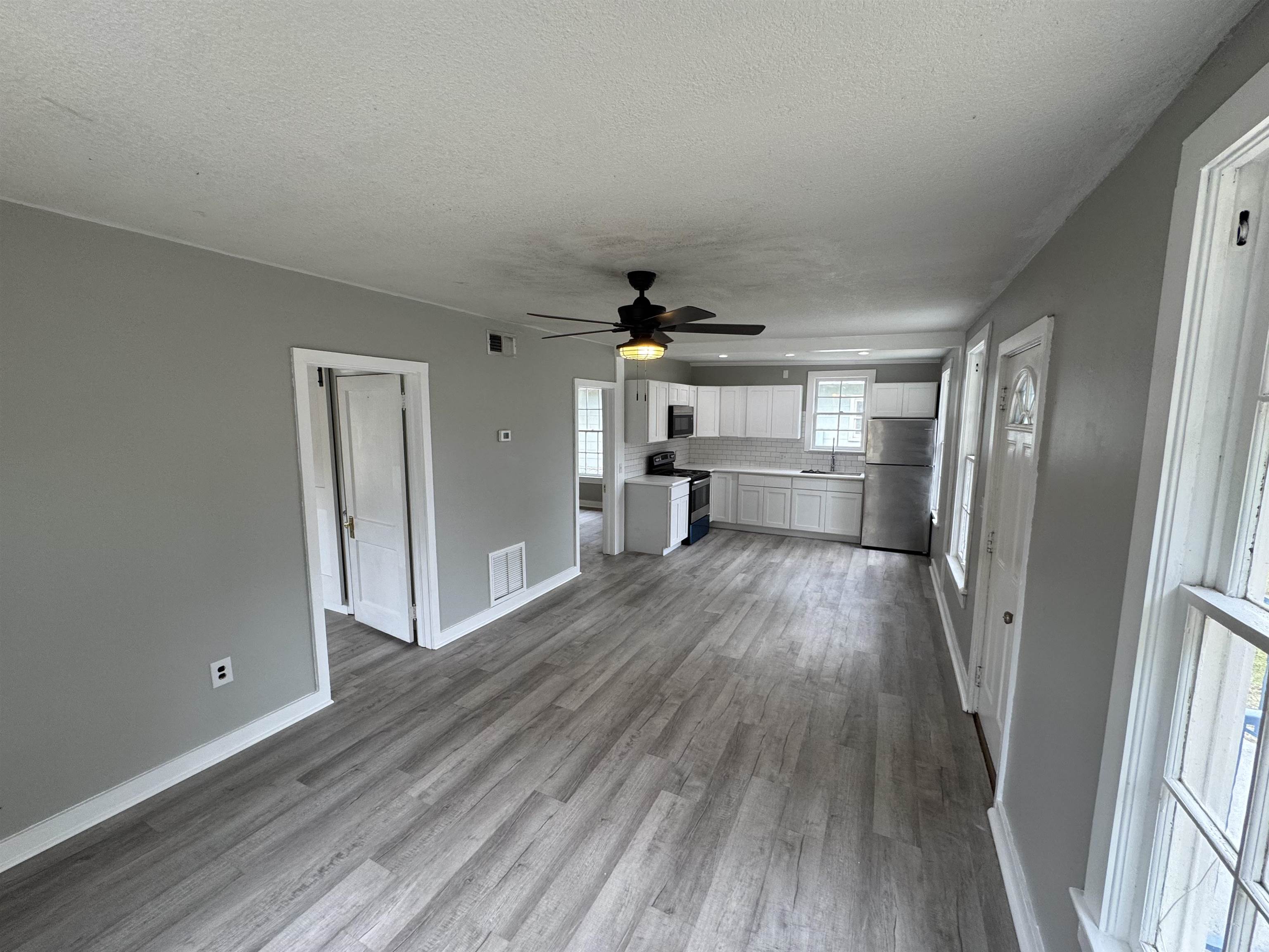 2909 Lane Street Palatka, FL 32177 - Photo 4 of 21 a view of empty room with wooden floor