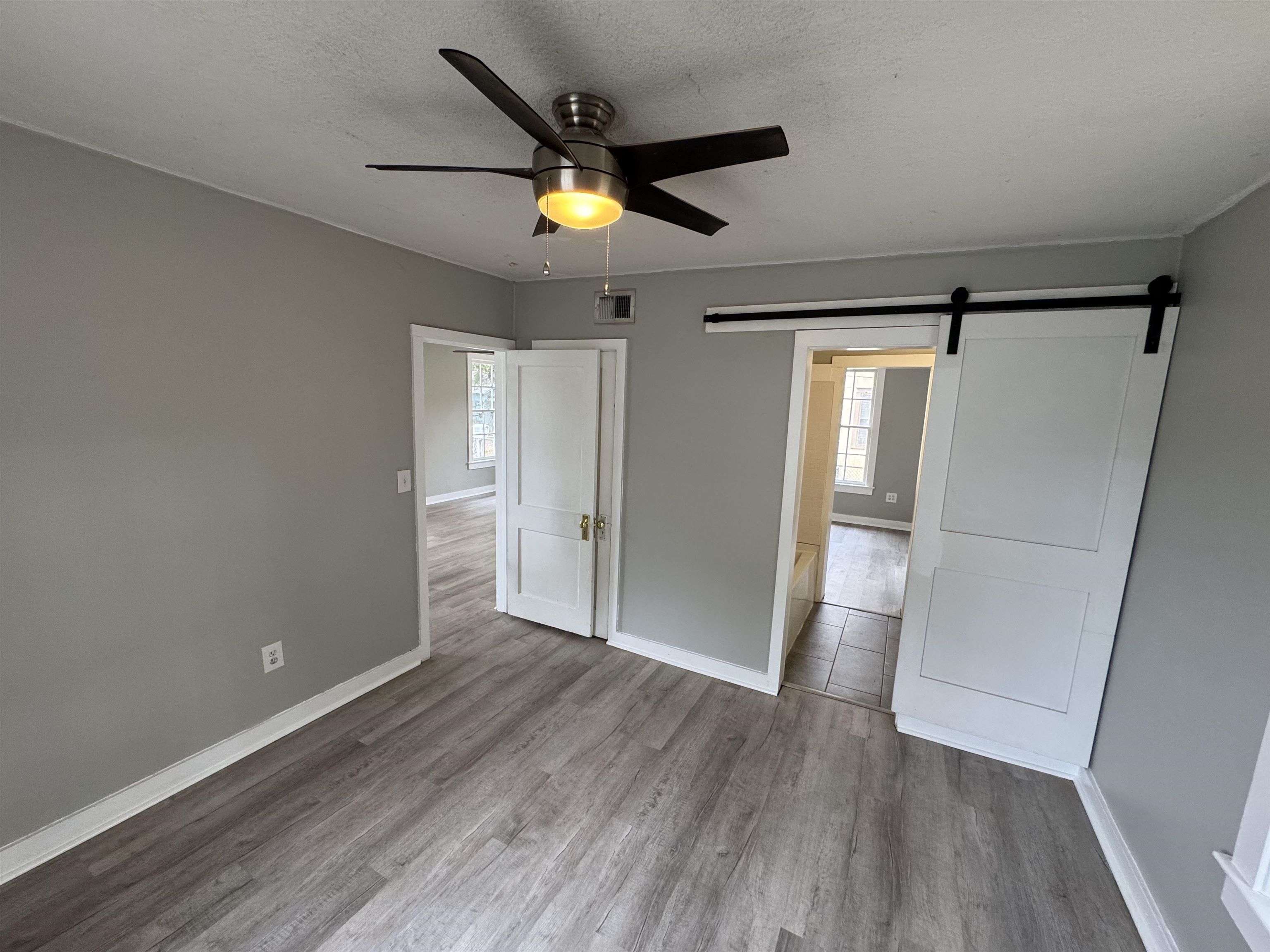 2909 Lane Street Palatka, FL 32177 - Photo 10 of 21 wooden floor in an empty room with a window