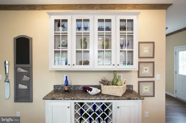 a house with granite countertop a sink and a window