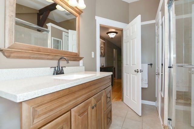 127 Haverhill Road Amesbury, MA 01913 - Photo 13 of 42 a bathroom with a sink and a mirror