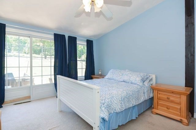 127 Haverhill Road Amesbury, MA 01913 - Photo 20 of 42 a bedroom with a bed and a window