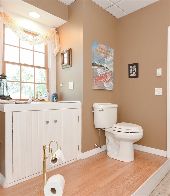 127 Haverhill Road Amesbury, MA 01913 - Photo 31 of 42 a bathroom with a sink toilet and window