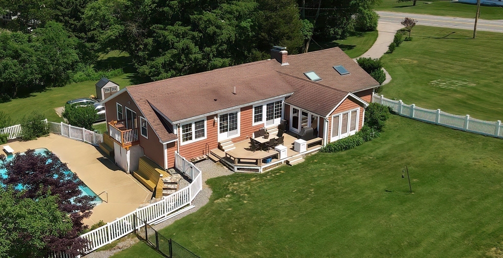 127 Haverhill Road Amesbury, MA 01913 - Photo 5 of 42 an aerial view of a house with swimming pool and garden
