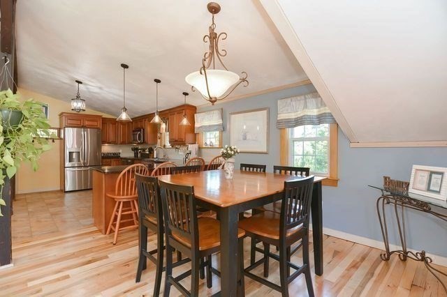127 Haverhill Road Amesbury, MA 01913 - Photo 8 of 42 a view of a dining room with furniture and wooden floor