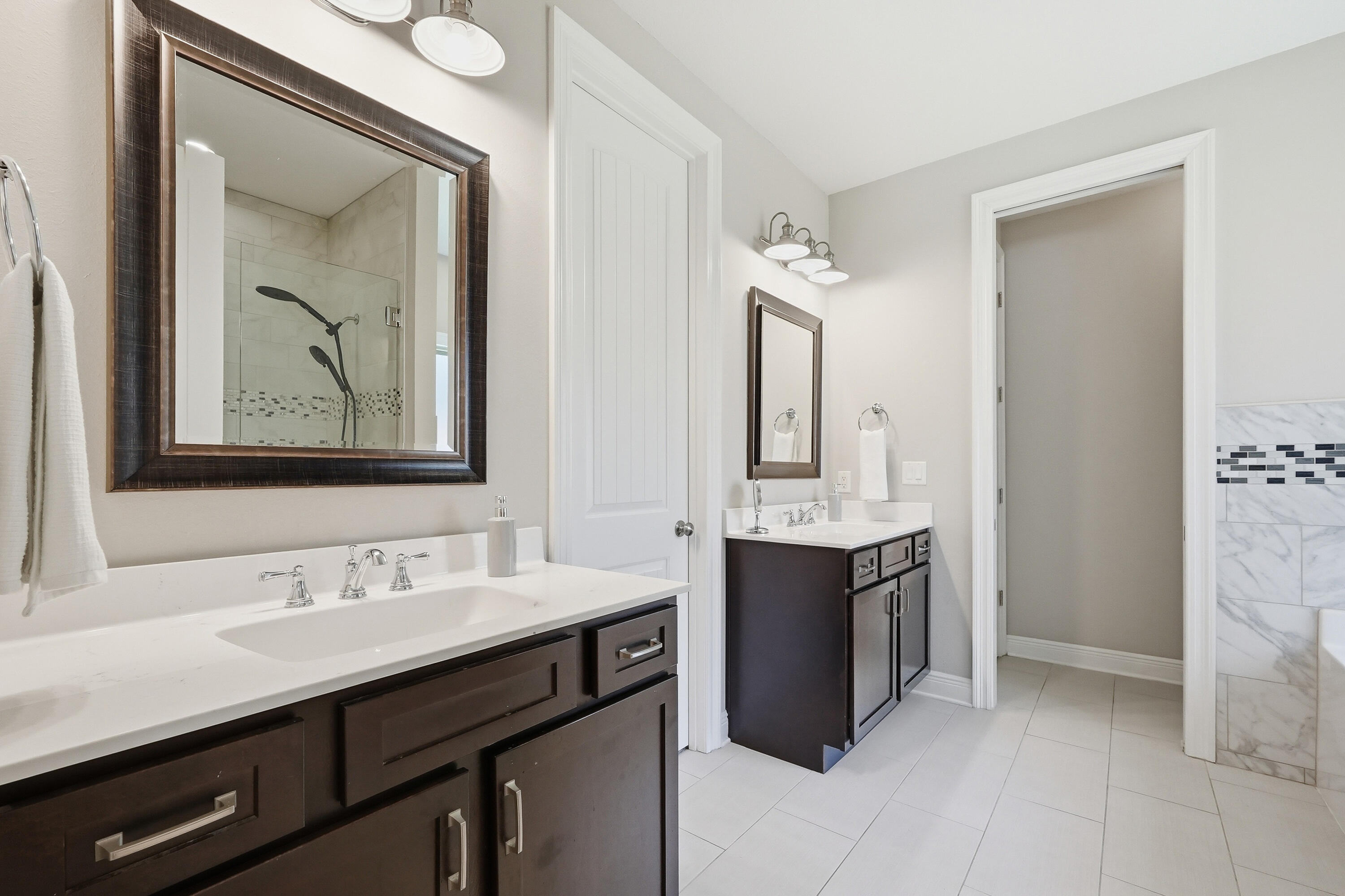 38 Marlborough Road Shalimar, FL 32579 - Photo 29 of 68 a bathroom with a double vanity sink mirror and bathtub