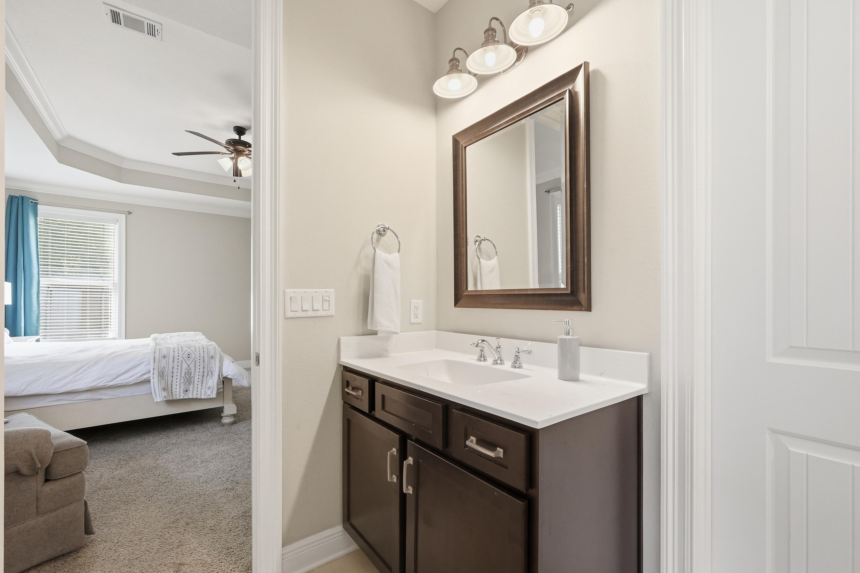 38 Marlborough Road Shalimar, FL 32579 - Photo 30 of 68 a en suite bathroom with a sink vanity and mirror