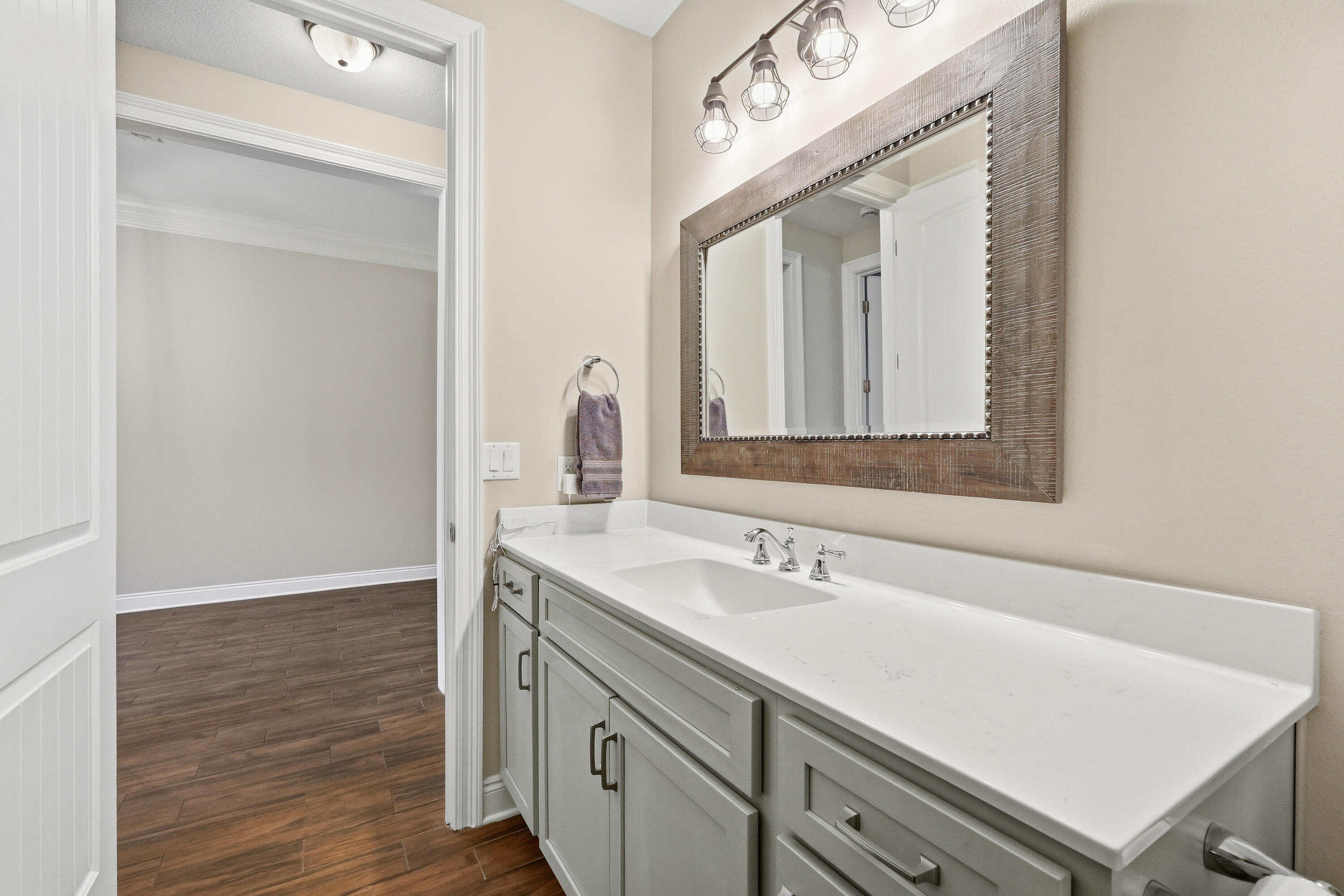 38 Marlborough Road Shalimar, FL 32579 - Photo 49 of 68 a bathroom with a sink vanity and a mirror