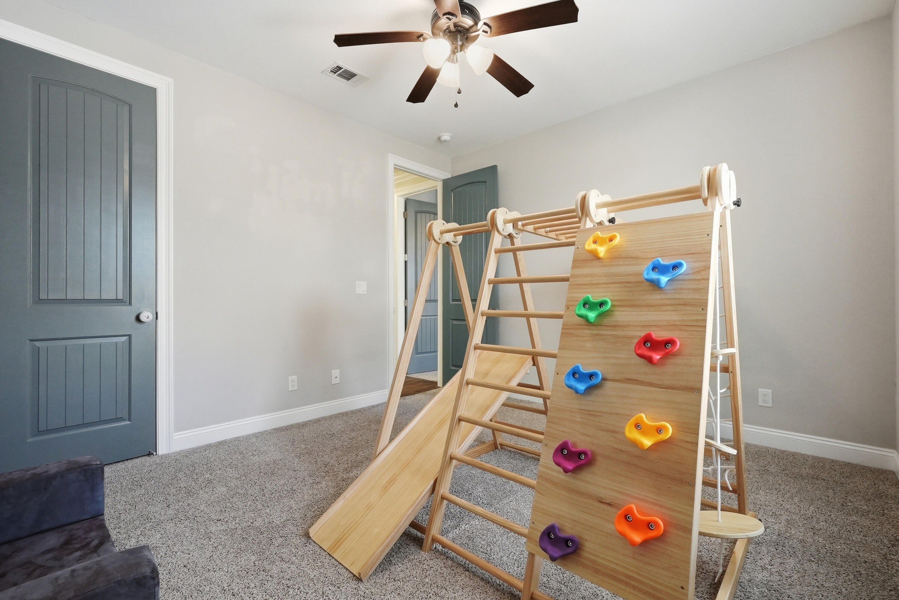 38 Marlborough Road Shalimar, FL 32579 - Photo 55 of 68 a bedroom with a bed and a chandelier