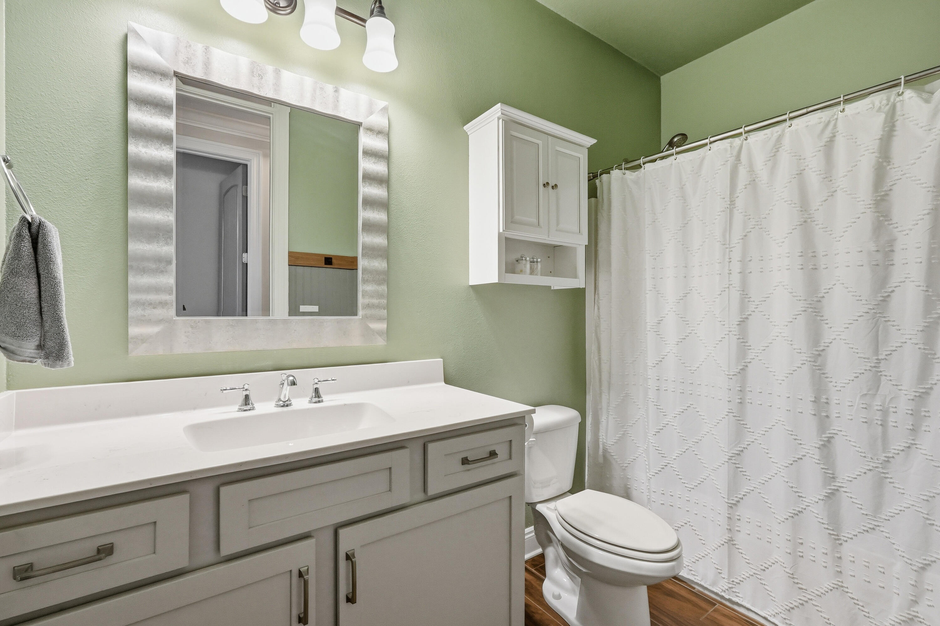 38 Marlborough Road Shalimar, FL 32579 - Photo 56 of 68 a bathroom with a sink a toilet and mirror