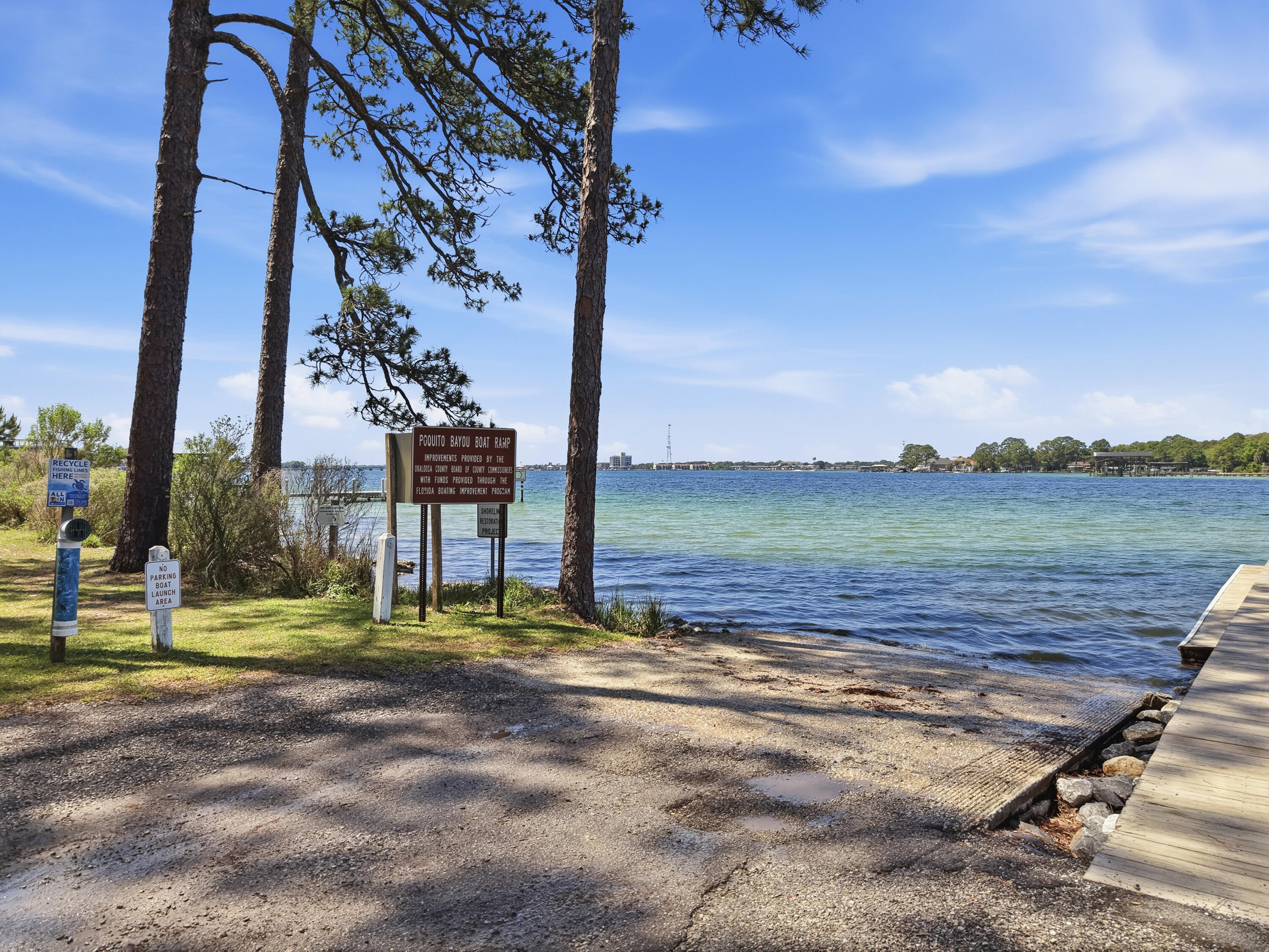 38 Marlborough Road Shalimar, FL 32579 - Photo 66 of 68 a view of a lake with a big yard and large trees