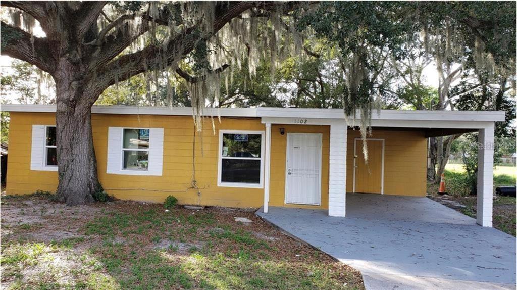 1102 Emeralda Road Orlando, FL 32808 - Photo 1 of 1 a front view of a house with garden