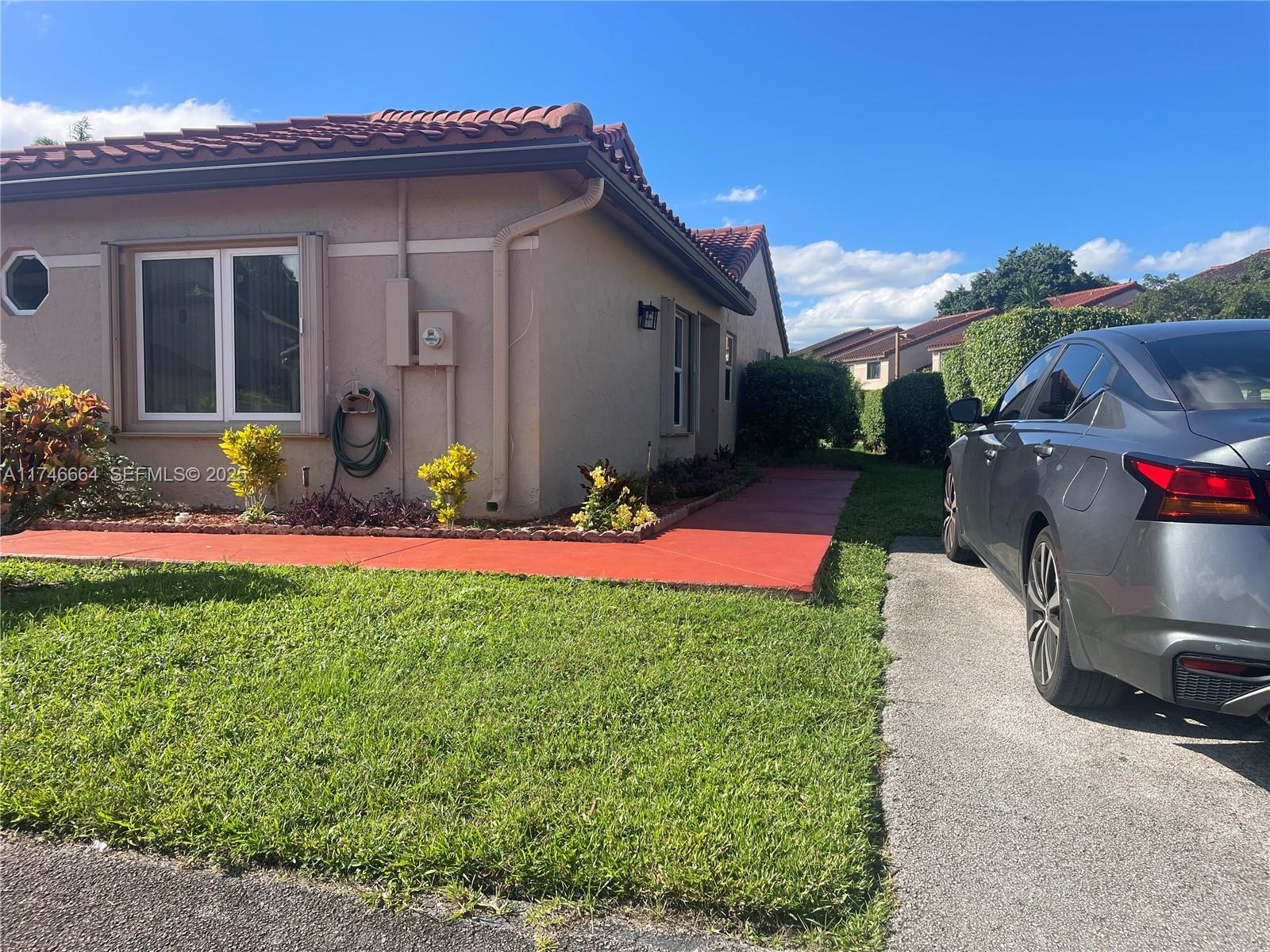Inverrary Lauderhill, FL 33319 - Photo 2 of 3 a view of a house with a yard
