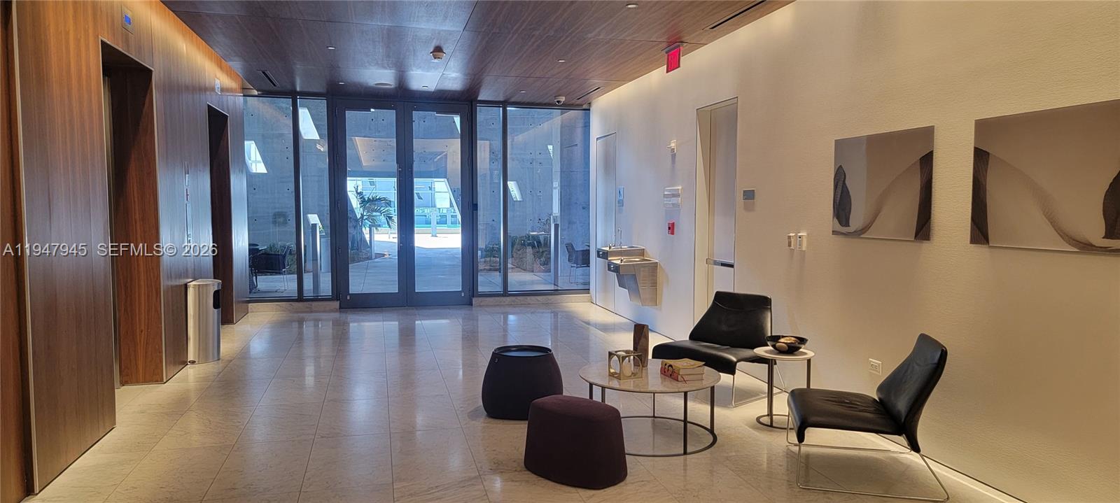 68 Southeast 6th Street, Unit 2110 Miami, FL 33131 - Photo 7 of 59 a workspace with furniture and window