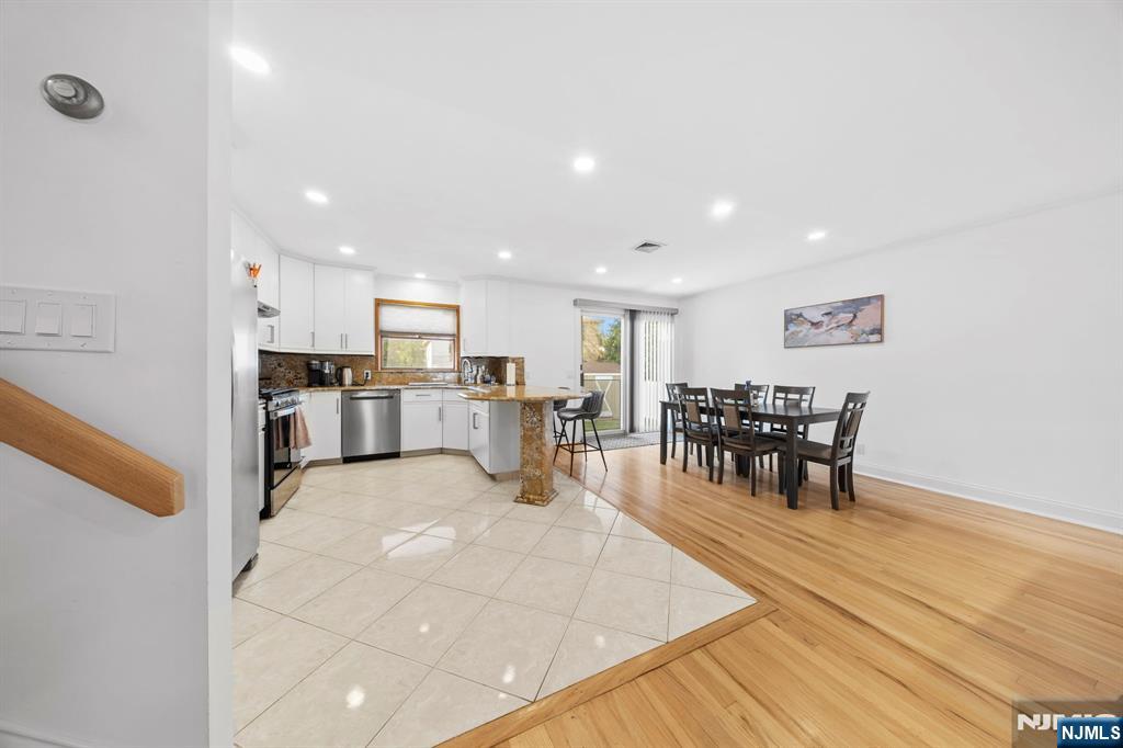 62 Sycamore Road Dumont, NJ 07628 - Photo 12 of 43 a view of a kitchen with dining table and chairs