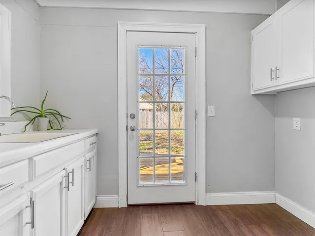 a view of an entryway with wooden floor