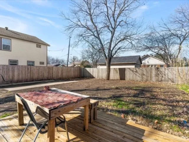 a view of a chairs and table on the wooden floor