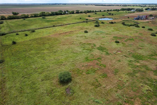 a view of a field with an outdoor space