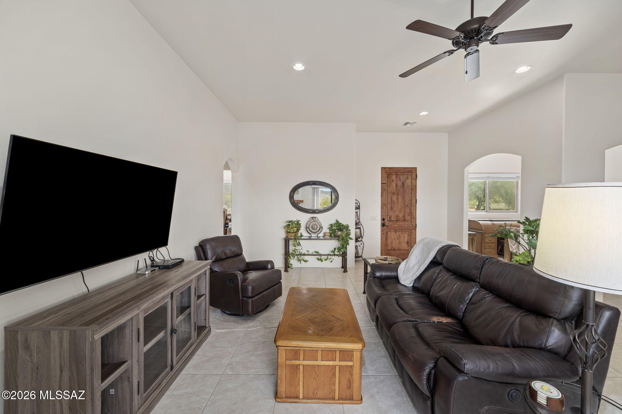 45 High View Court Tubac, AZ 85646 - Photo 19 of 44 a living room with furniture and a flat screen tv